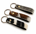 Rustic cowhide loop keychain straps with metal split rings in mixed natural patterns