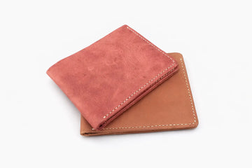 Minimalist handmade-style slim wallet with rustic stitching and card pockets