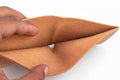 Minimalist handmade-style slim wallet with rustic stitching and card pockets